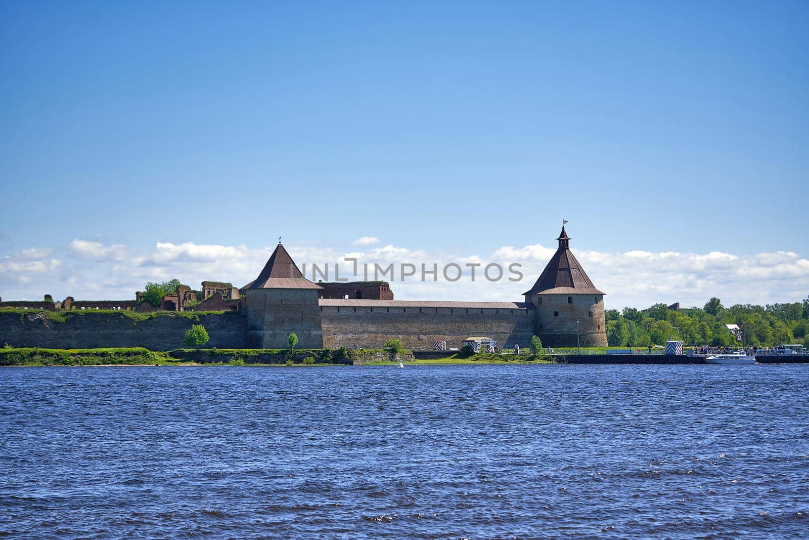 View of the old stone fortress with a watchtower. Fortress Oreshek on a sunny summer day