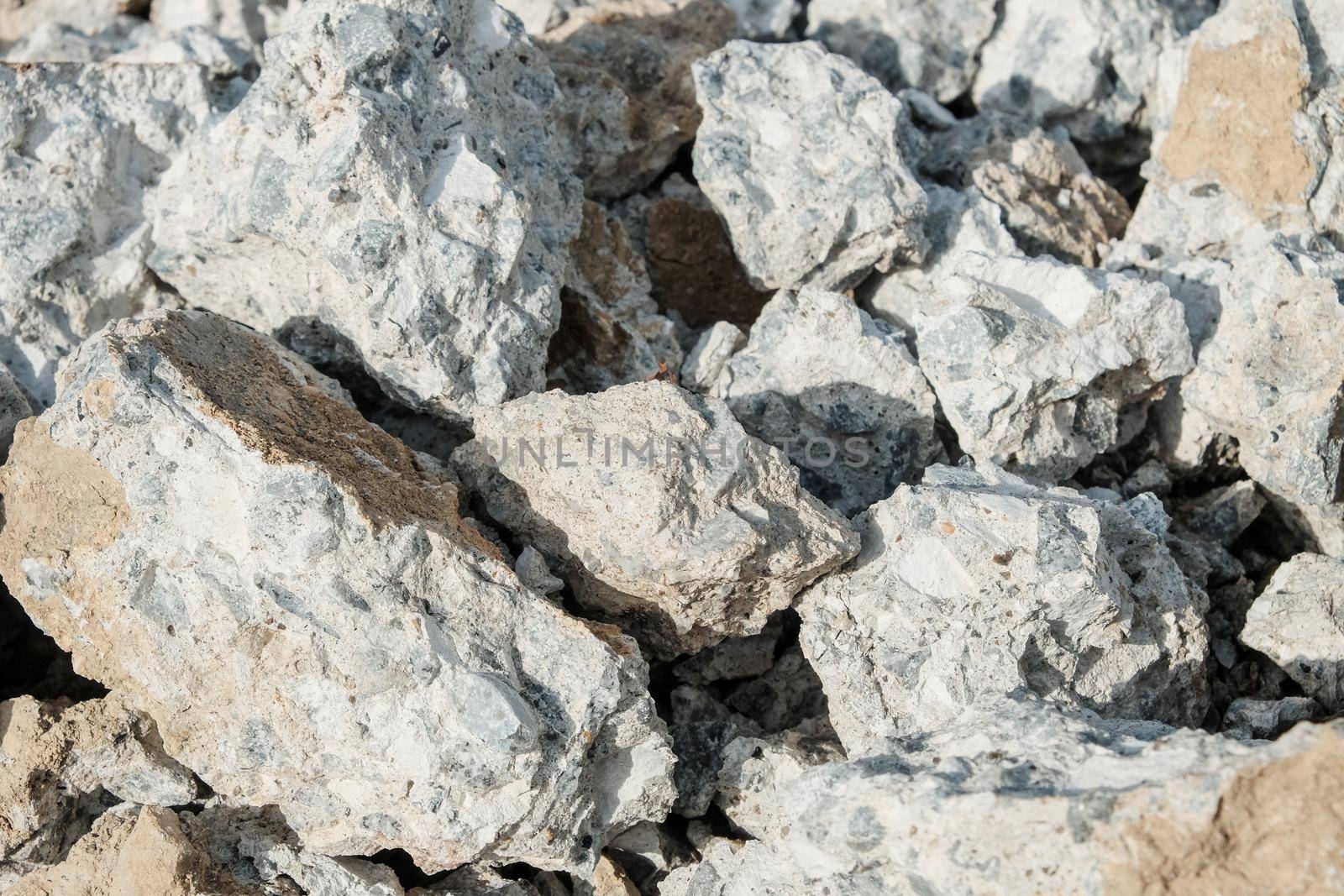 Large concrete stones. Construction waste after dismantling the old building. Close-up.