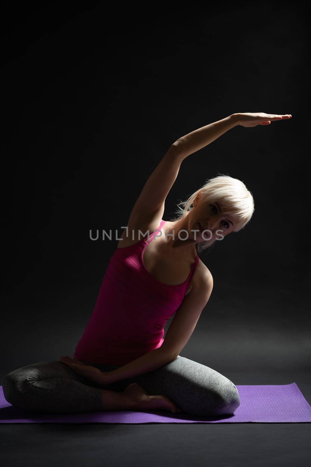 Woman exercising pilates. Siren exercise.