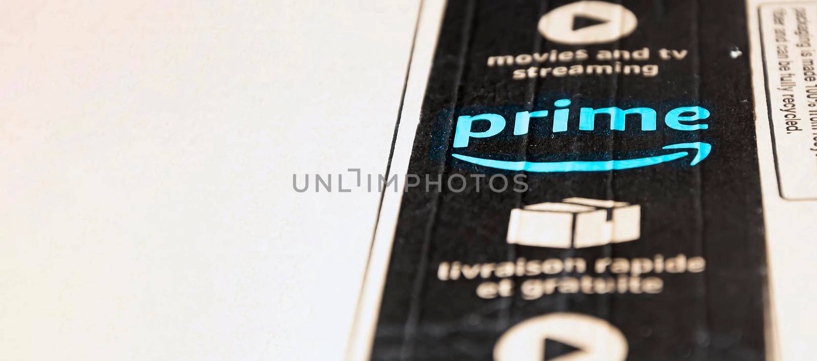 Rome, Italy, June 2021: The Amazon Prime logo printed on the black safety tape on a cardboard box. Packaging for shipping and online shopping. Illustrative editorial