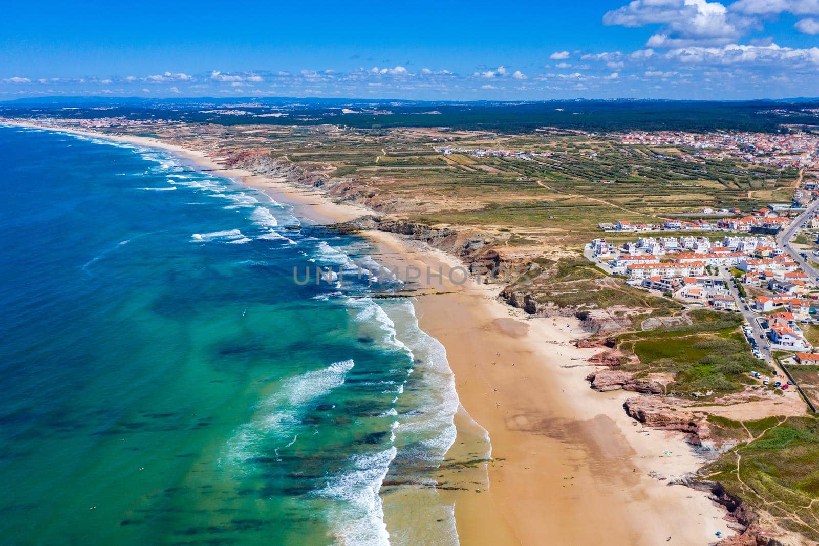 Campismo beach and Dunas beach and Island Baleal near Peniche on the shore of the Atlantic ocean in west coast of Portugal. Beautiful Baleal beach at Baleal peninsula close to Peniche, Portugal.
