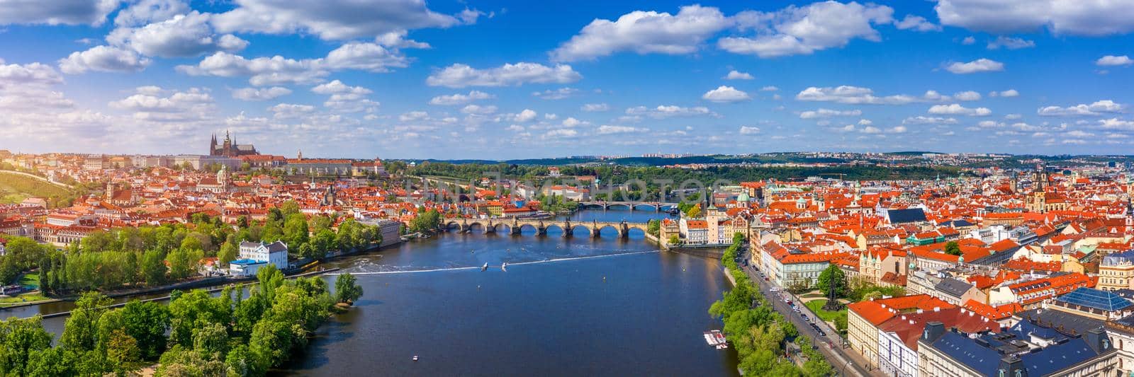 Prague scenic spring aerial view of the Prague Old Town pier architecture Charles Bridge over Vltava river in Prague, Czechia. Old Town of Prague with the Castle in the background, Czech Republic.
