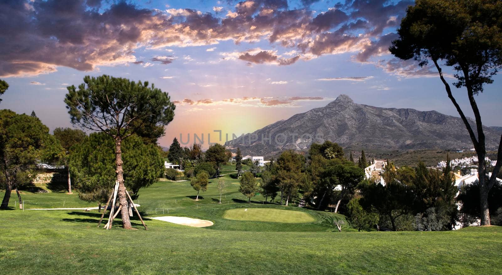 golf course and green  in Marbella, Spain, at sunset