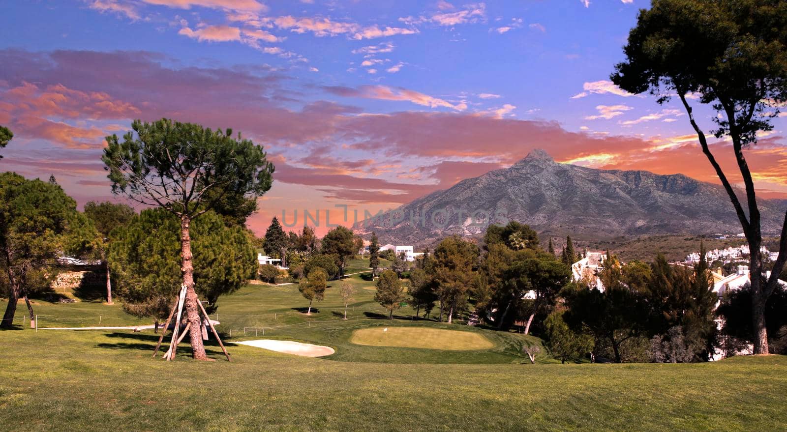 golf course and green  in Marbella, Spain, at sunset