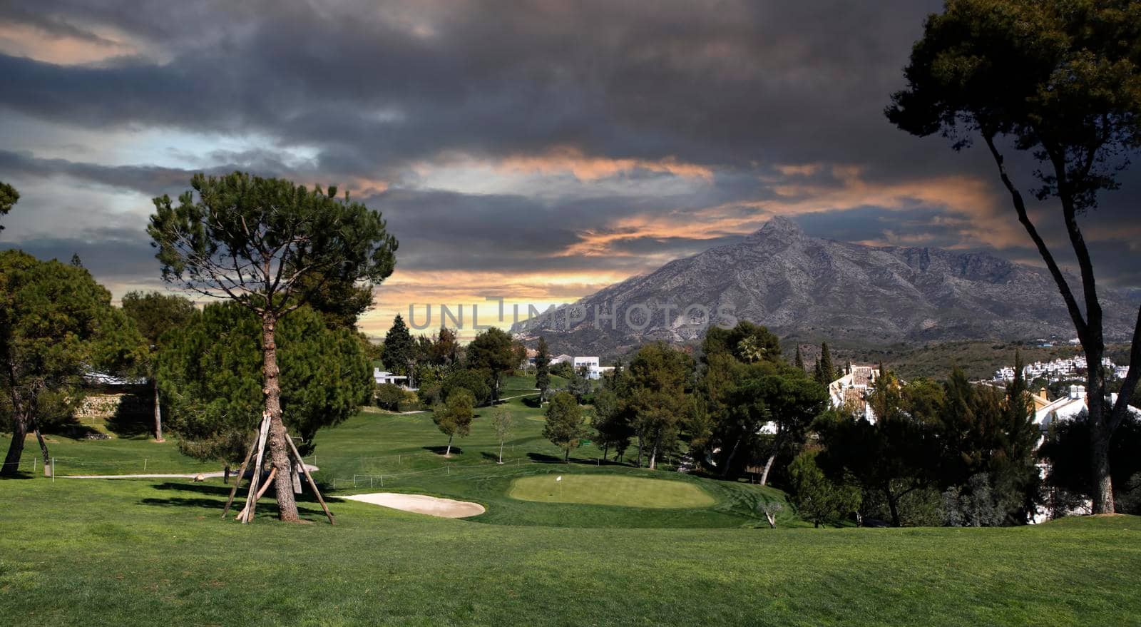 golf course and green  in Marbella, Spain, at sunset