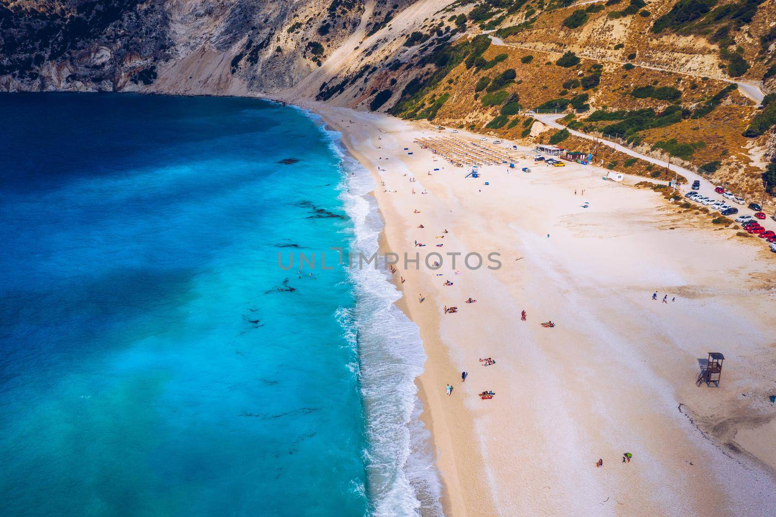 Aerial drone view of iconic turquoise and sapphire bay and beach of Myrtos, Kefalonia (Cephalonia) island, Ionian, Greece. Myrtos beach, Kefalonia island, Greece. Beautiful view of Myrtos beach.