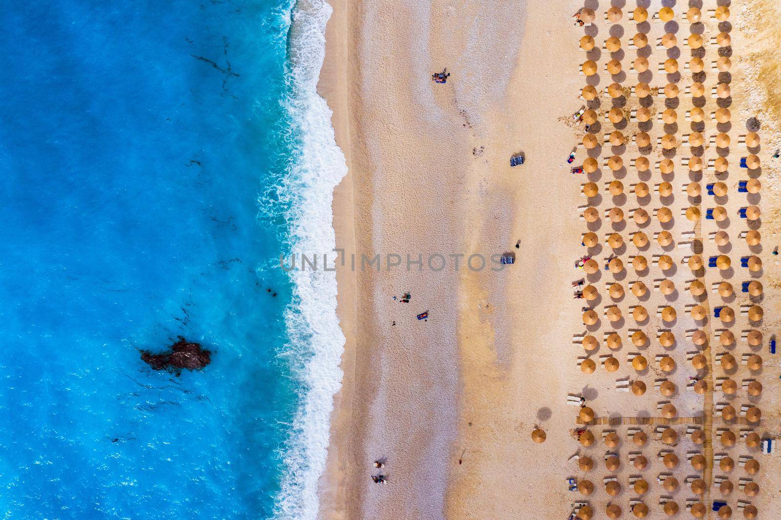 Aerial drone view of iconic turquoise and sapphire bay and beach of Myrtos, Kefalonia (Cephalonia) island, Ionian, Greece. Myrtos beach, Kefalonia island, Greece. Beautiful view of Myrtos beach.