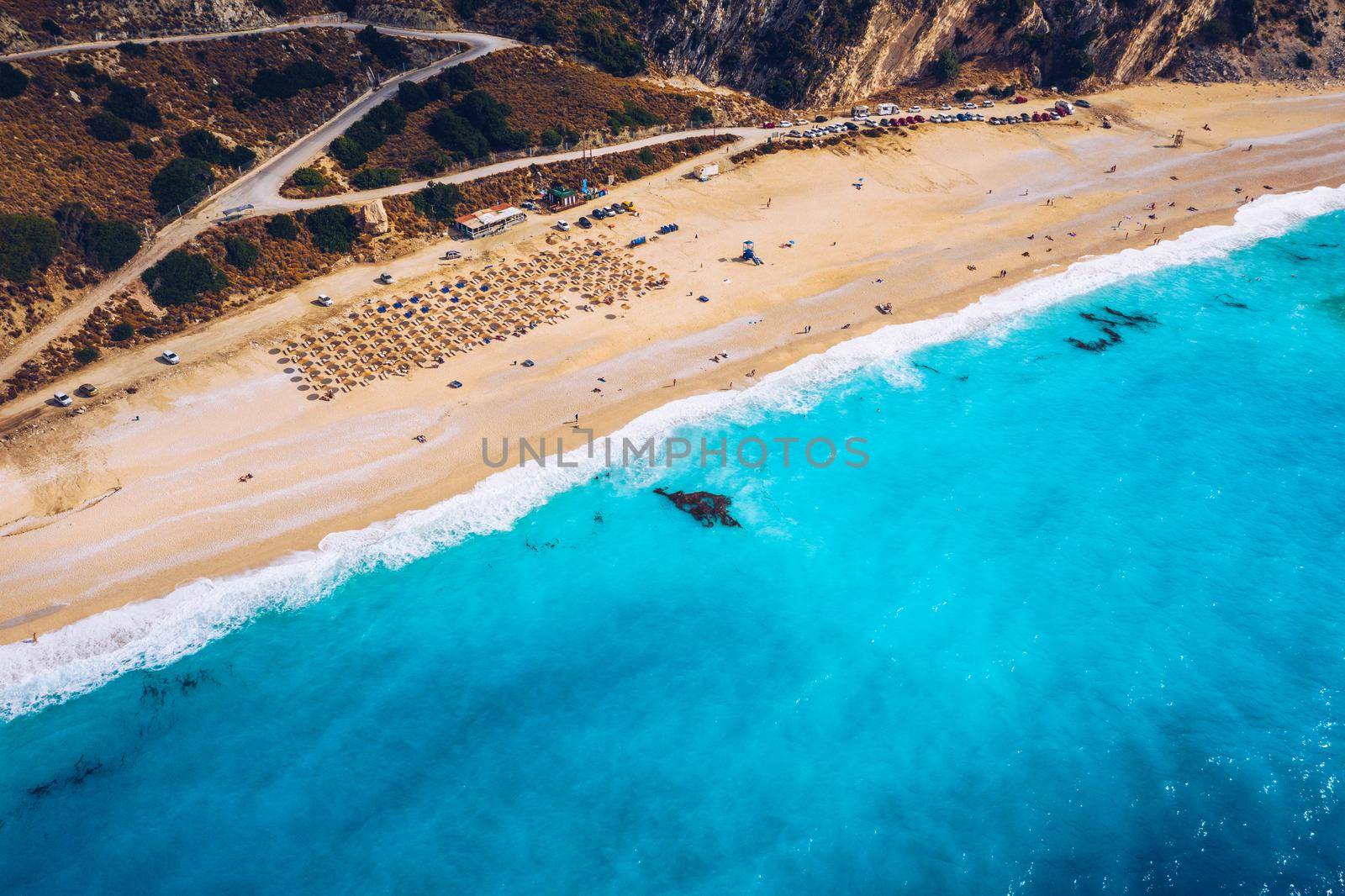 Aerial drone view of iconic turquoise and sapphire bay and beach of Myrtos, Kefalonia (Cephalonia) island, Ionian, Greece. Myrtos beach, Kefalonia island, Greece. Beautiful view of Myrtos beach.