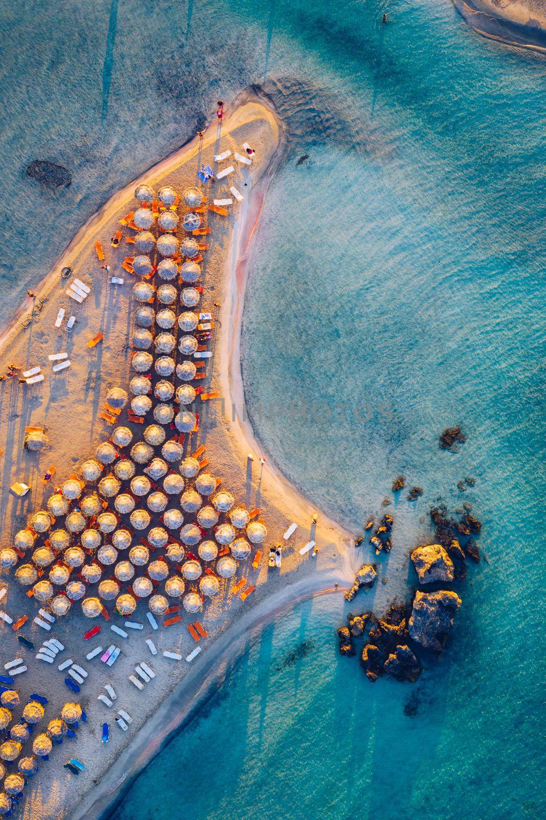 Aerial drone shot of beautiful turquoise beach with pink sand Elafonissi, Crete, Greece. Best beaches of Mediterranean, Elafonissi beach, Crete, Greece. Famous Elafonisi beach on Greece island, Crete.