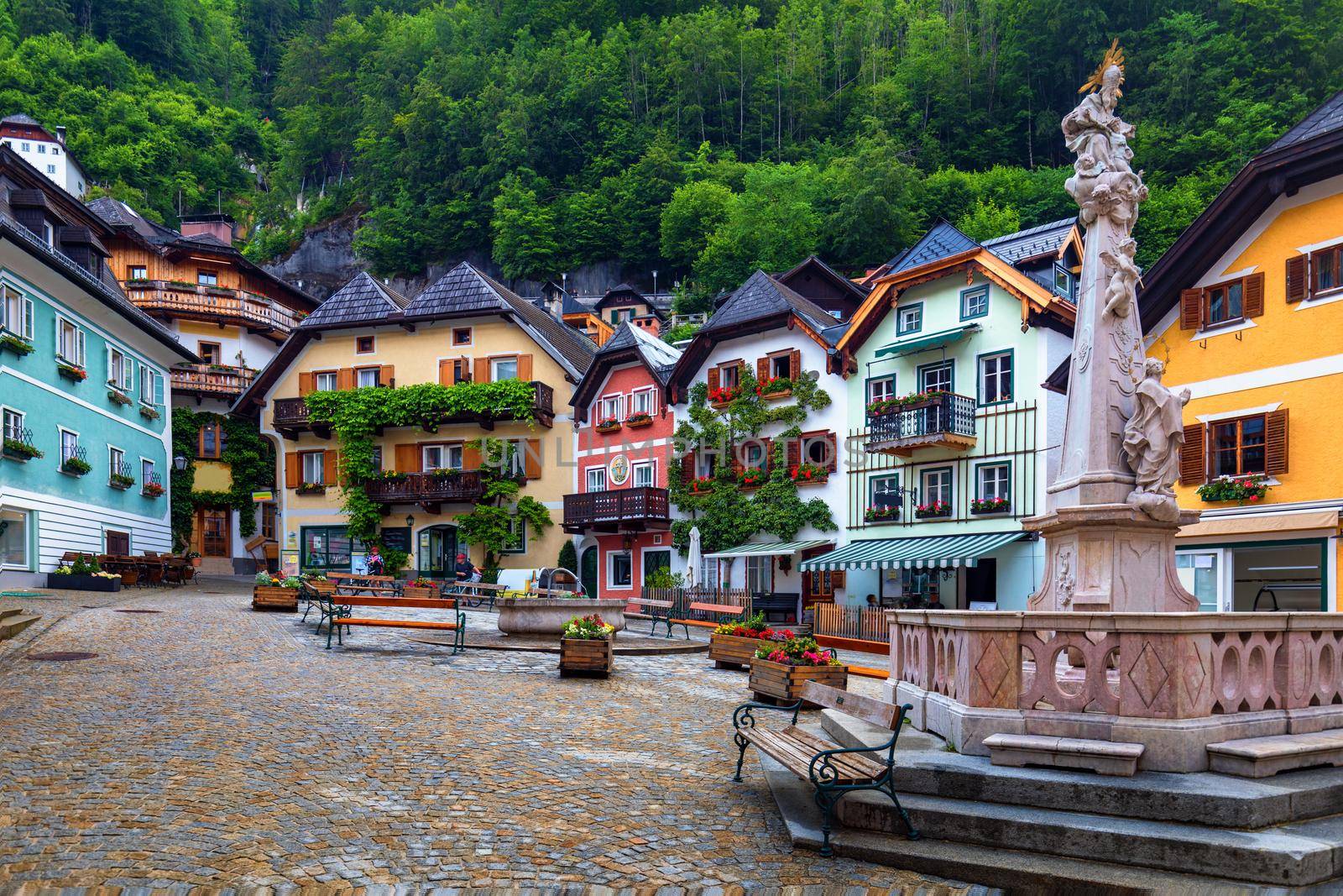 Scenic picture-postcard view of famous Hallstatt mountain village in the Austrian Alps, Salzkammergut region, Hallstatt, Austria. Hallstatt village on Hallstatter lake in Austrian Alps.