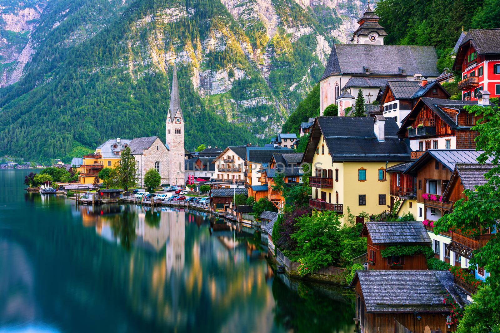Scenic picture-postcard view of famous Hallstatt mountain village in the Austrian Alps, Salzkammergut region, Hallstatt, Austria. Hallstatt village on Hallstatter lake in Austrian Alps.