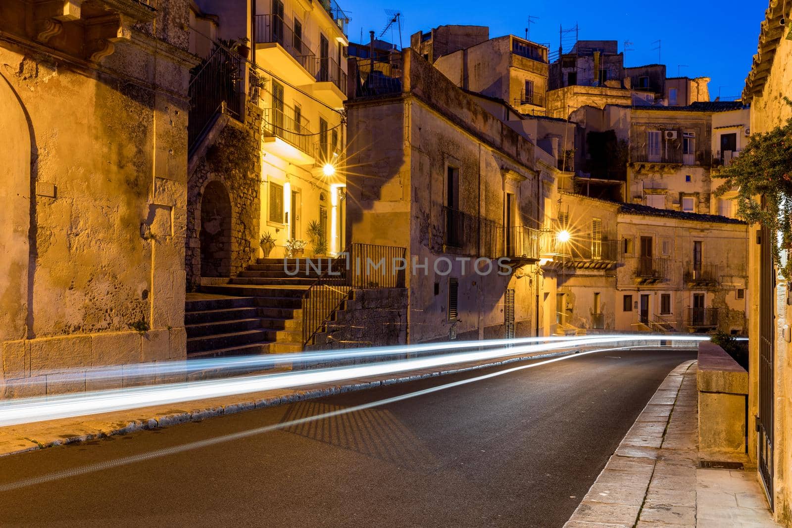 Narrow typical italian old street in Ragusa (Ragusa Ibla), Sicily, Italy , UNESCO heritage town on Italian island of Sicily. View of the city Ragusa Ibla, Val di Noto, Sicily, Italy.  