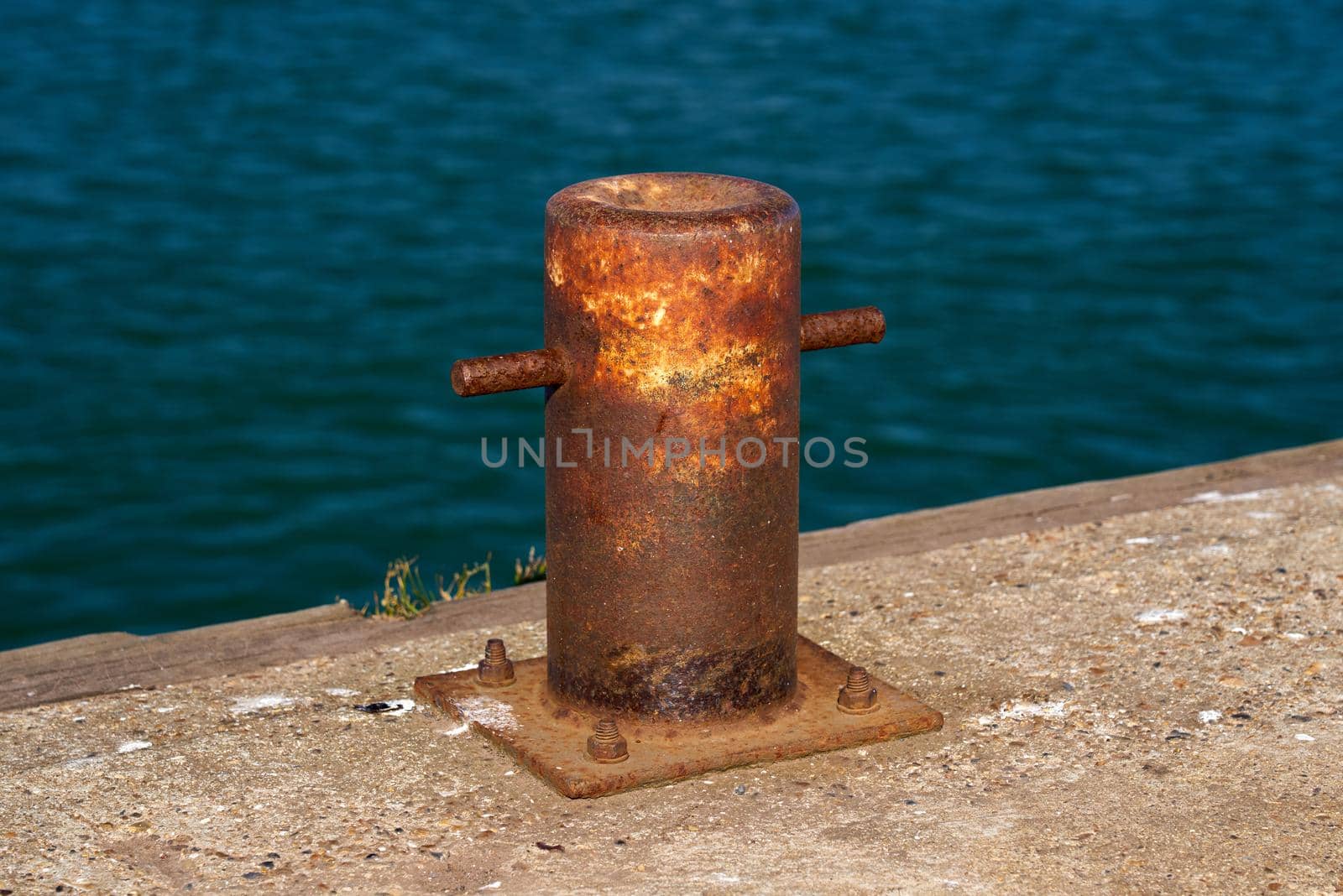 Side view of a samson post style single bitt mooring bollard for boats by ChrisWestPhoto