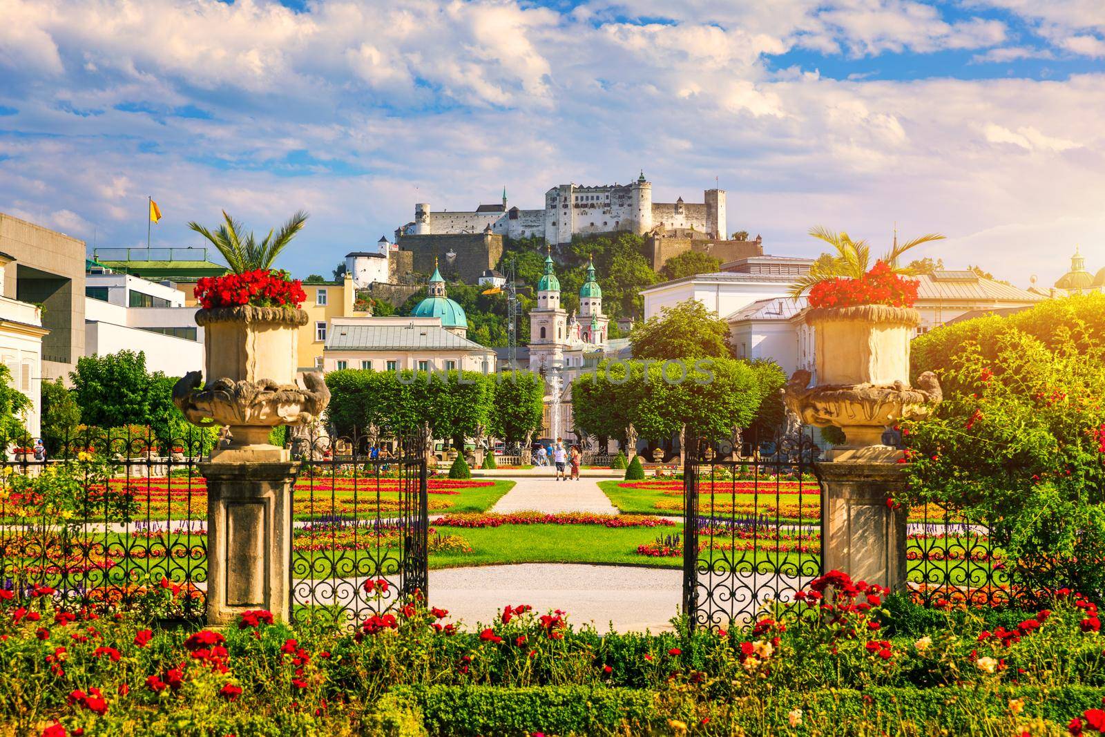 Beautiful view of famous Mirabell Gardens with the old historic Fortress Hohensalzburg in the background in Salzburg, Austria. Famous Mirabell Gardens with historic Fortress in Salzburg, Austria.