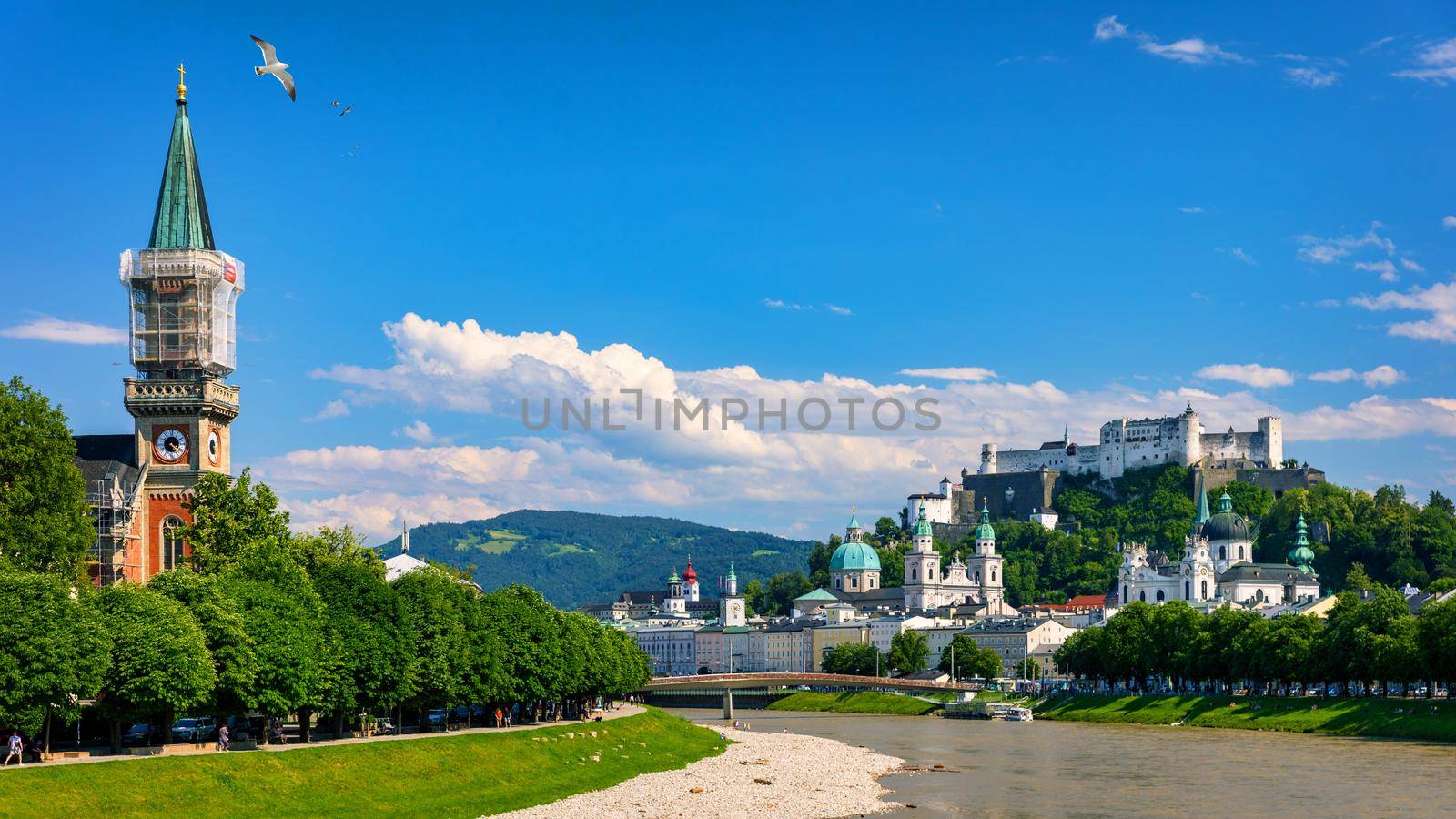 Panoramic view of Salzburg skyline with Fortress Hohensalzburg and river Salzach, Salzburger Land, Austria. Salzburg skyline with river Salzach in springtime, Austria.