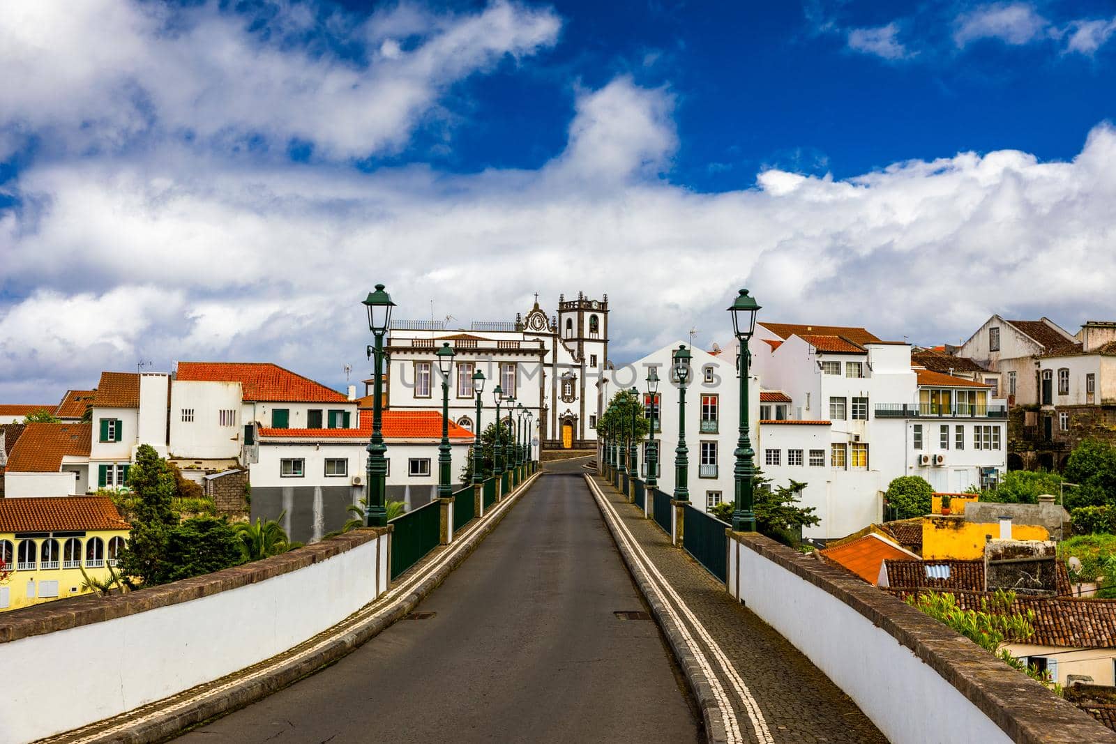 View of Nordeste on Sao Miguel Island, Azores. Old stone arch bridge in Nordeste village, Sao Miguel, Azores. Nordeste village with white town buildings on the island of Sao Miguel, Azores, Portugal.