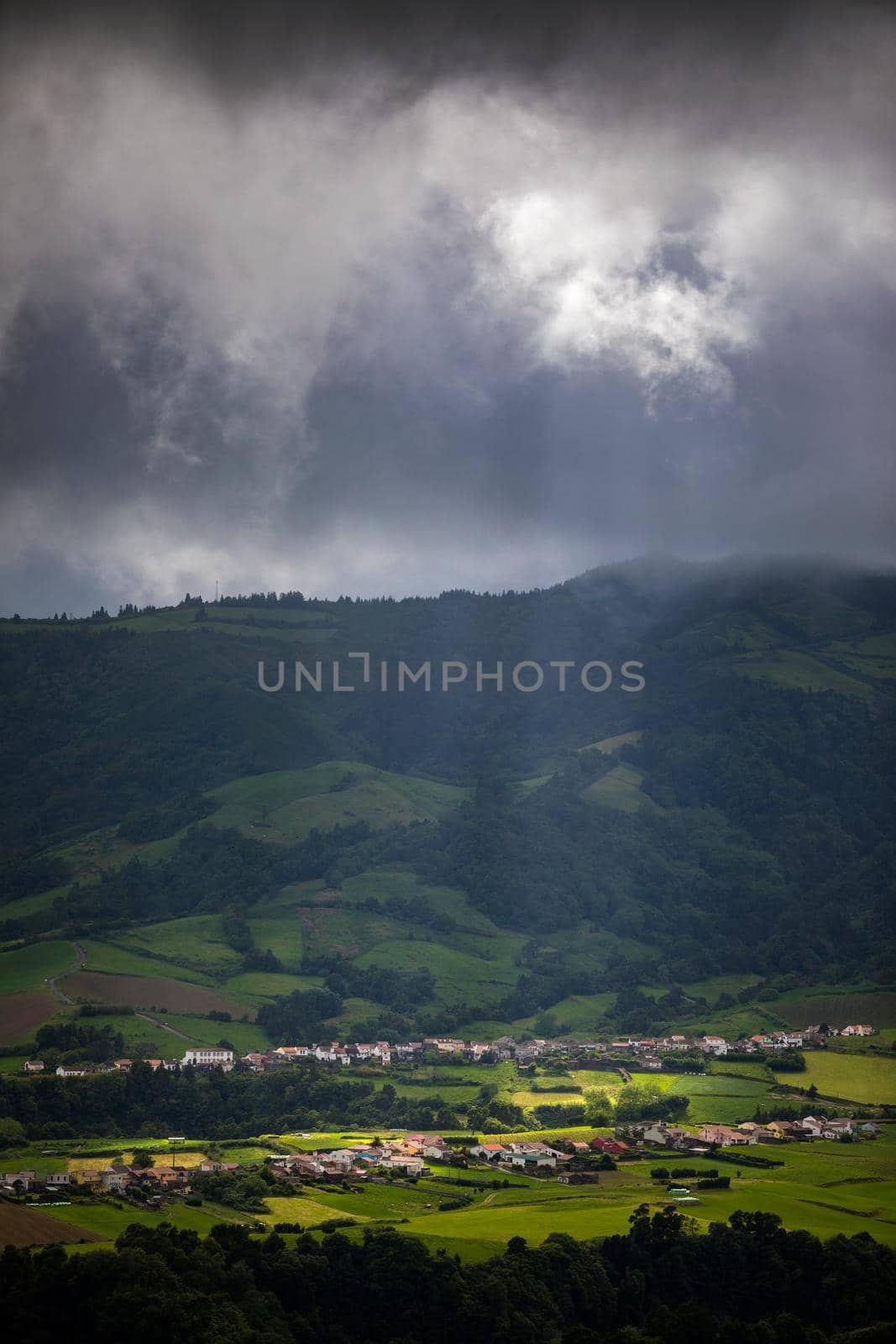 Beautiful nature view on Azores with small villages, tows, green nature fields. Amazing Azores. View of typical Azores village in Sao Miguel island, Azores, Portugal.