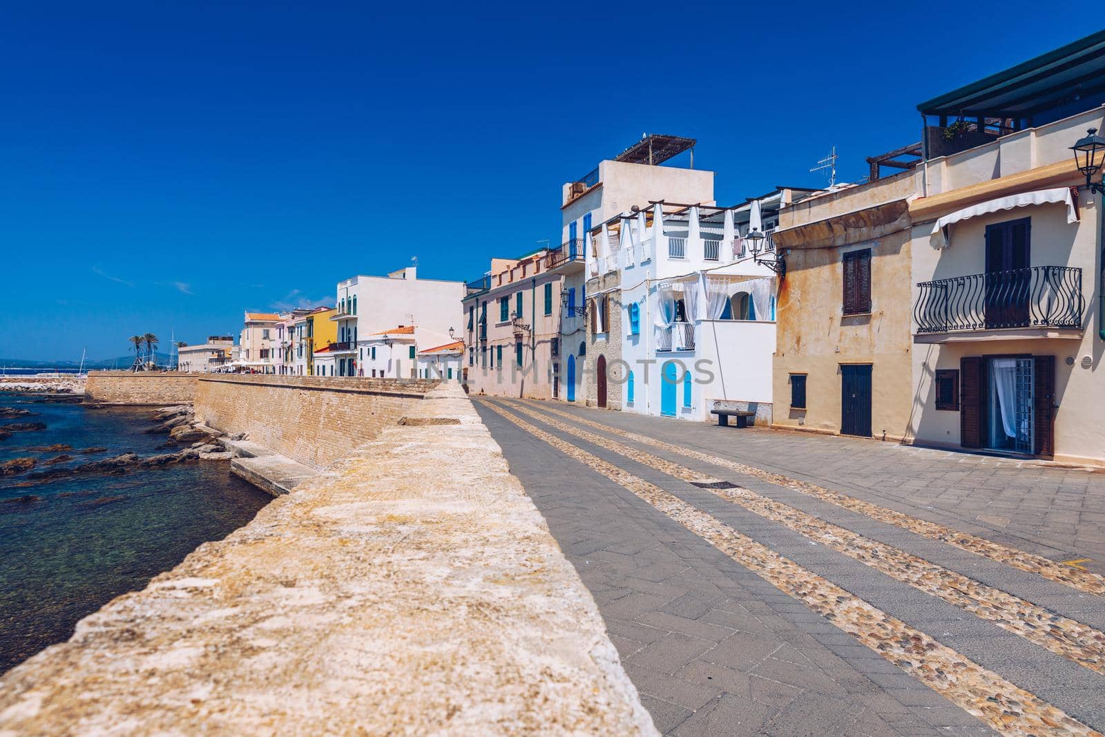 Alghero old town, Alghero street view on a beautiful day. Alghero, Italy. Panoramic aerial view of Alghero, Sardinia, Italy. 