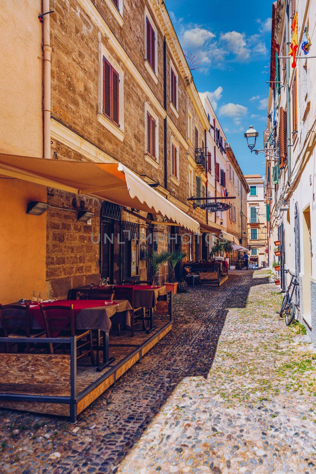 Alghero old town, Alghero street view on a beautiful day. Alghero, Italy. Panoramic aerial view of Alghero, Sardinia, Italy. 
