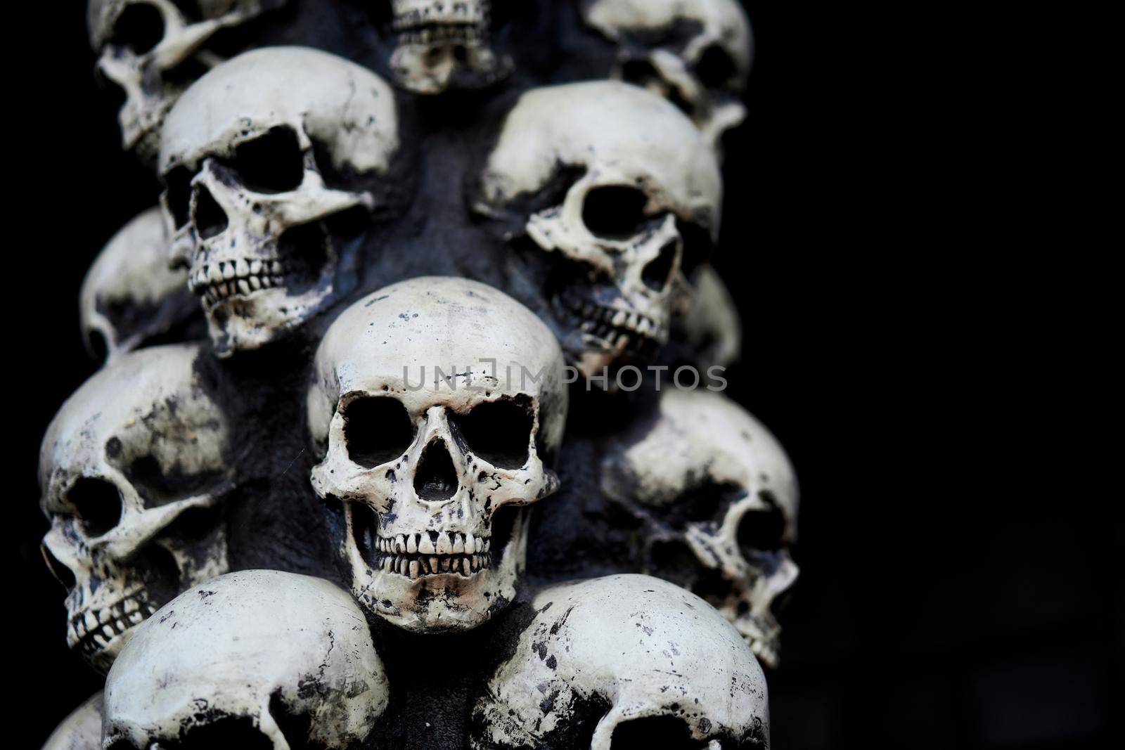 Skull Halloween background Many people skulls stand on top of each other. Mystic creepy concept. Abstract nightmare occult memorial