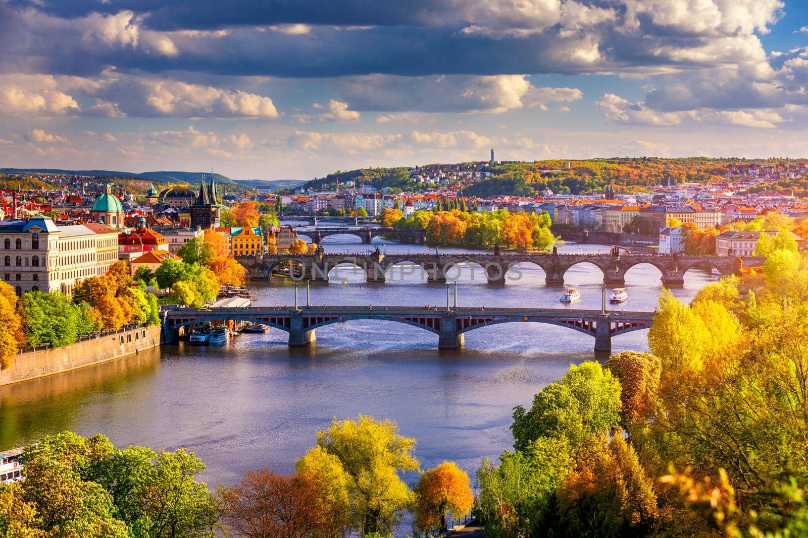 Autumn view to Charles bridge on Vltava river in Prague, Czech Republic. Autumn view to Charles Bridge, Prague old town and Vltava river from popular view point in the Letna park (Letenske sady).