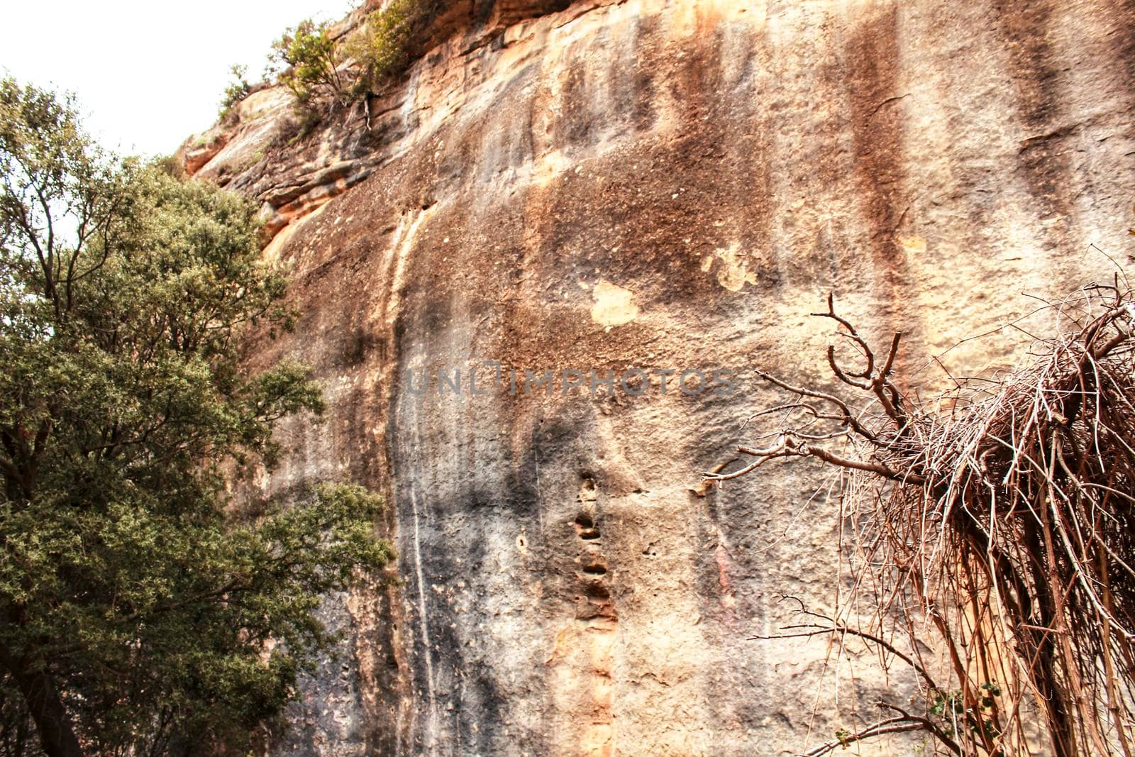 Mountain wall with colorful streaks in the Sierra of Alcaraz, Castile-la Mancha community, Spain