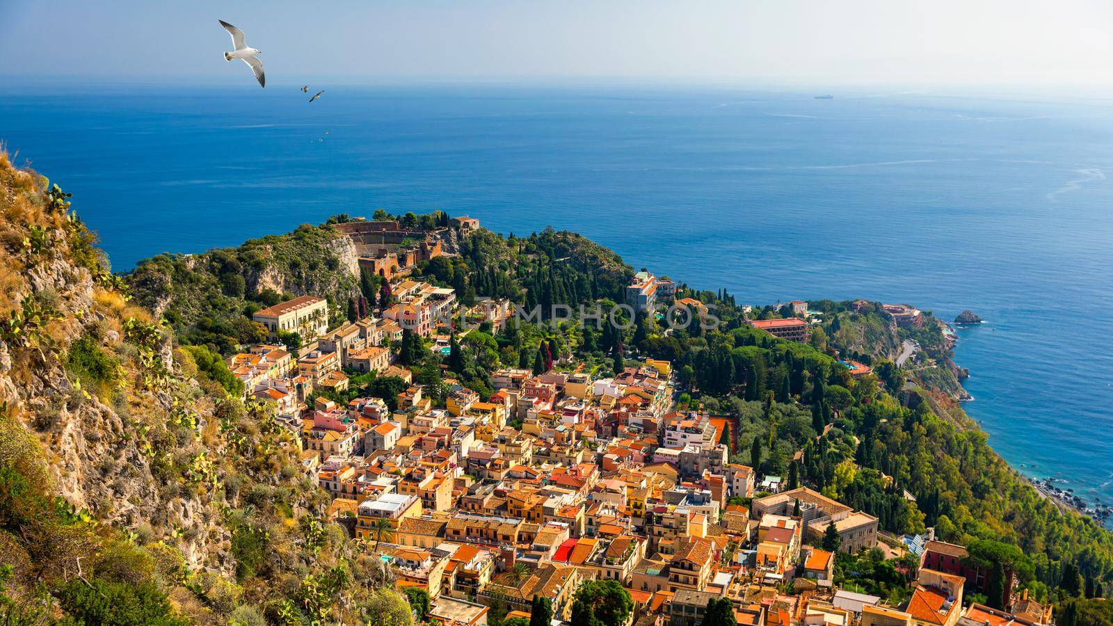 Ruins of Ancient Greek theater in Taormina, Sicily, Italy. Taormina located in Metropolitan City of Messina, on east coast of island of Sicily. 