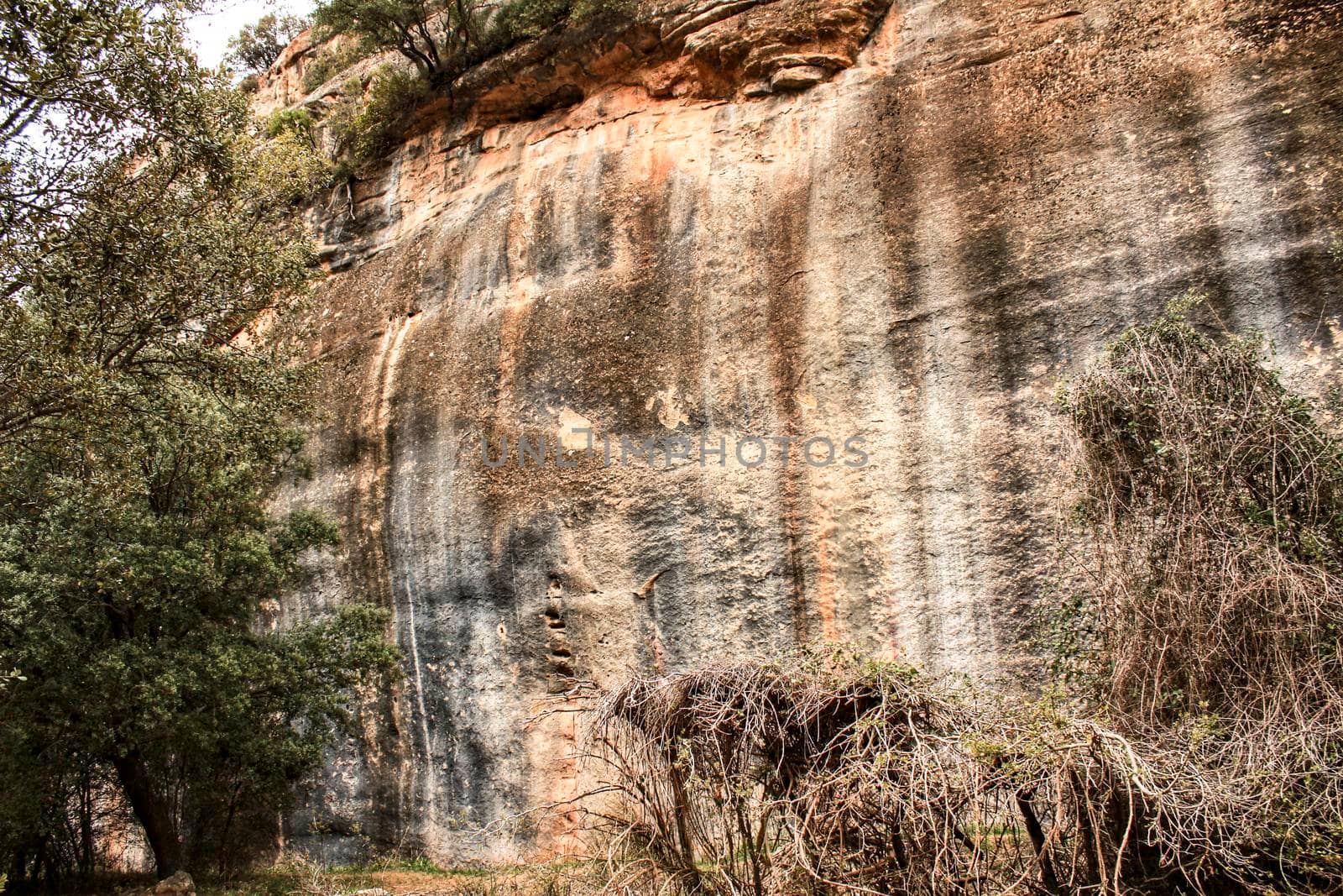 Mountain wall with colorful streaks in the Sierra of Alcaraz, Castile-la Mancha community, Spain