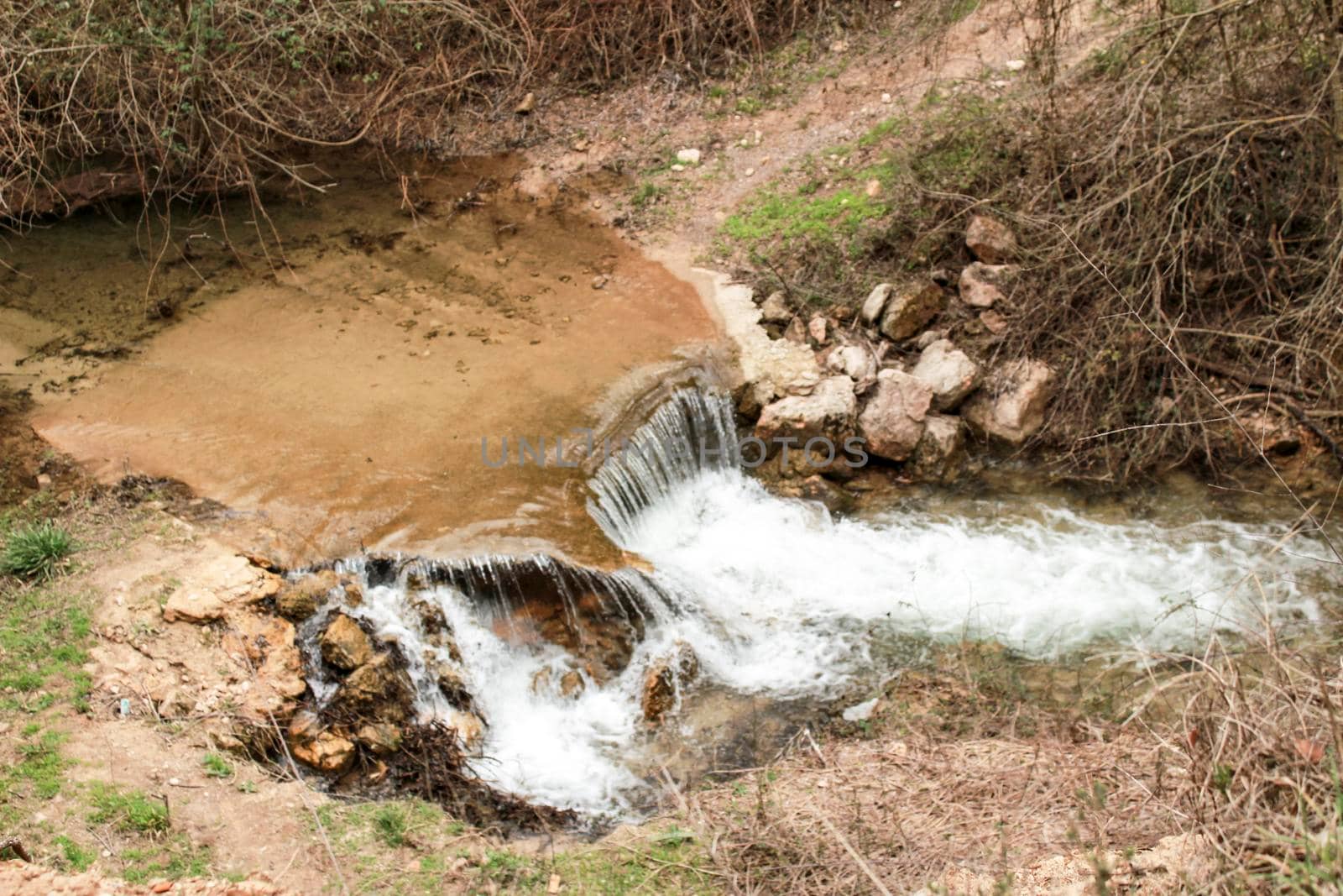 Waterfall called El Salto del Caballo and Alcaraz river crossing the natural site of Los Batanes, Alcaraz, Albacete, Spain