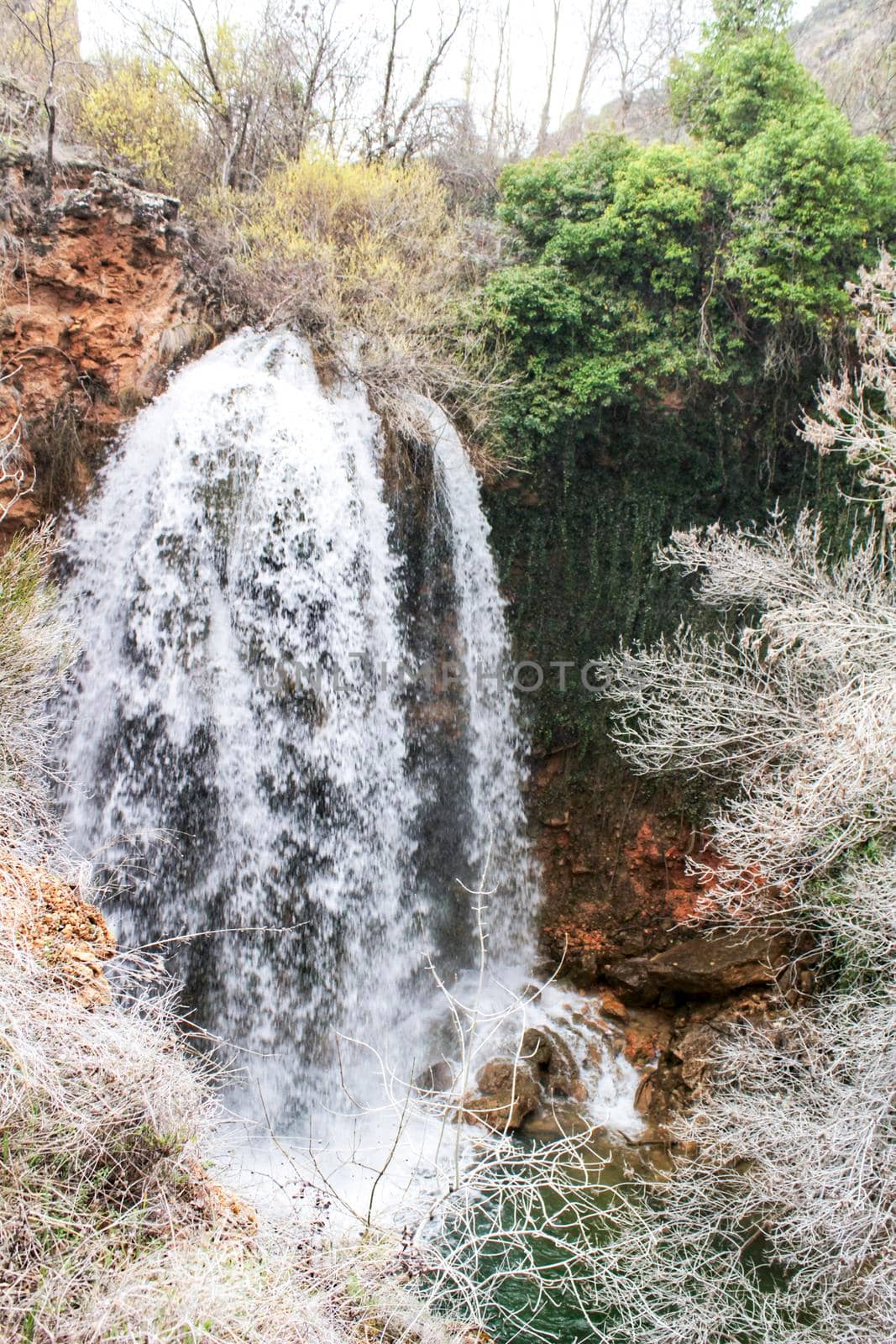 Waterfall called El Salto del Caballo and The Alcaraz river crossing the natural site of Los Batanes, Alcaraz, Albacete, Spain