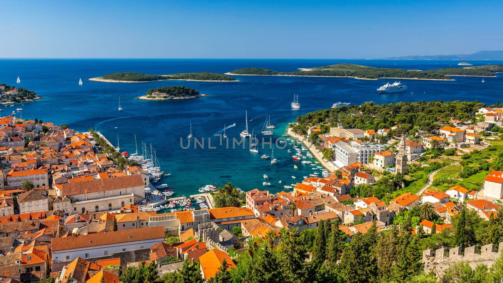 View at amazing archipelago in front of town Hvar, Croatia. Harbor of old Adriatic island town Hvar. Popular touristic destination of Croatia. Amazing Hvar city on Hvar island, Croatia.