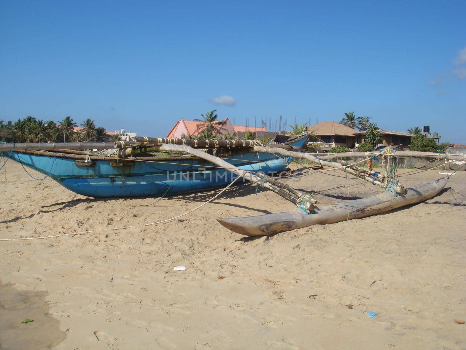 A catamaran fishing boat on a beach in Sri Lanka.