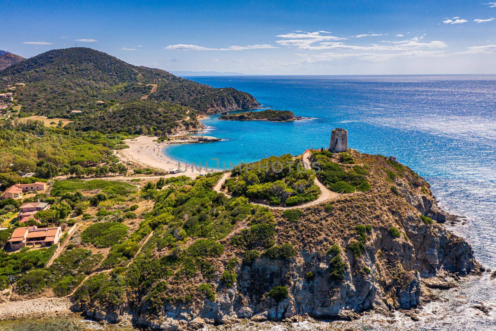 Torre di Chia view from flying drone. Acropoli di Bithia with Torre di Chia tower on background. Aerial view of Sardinia island, Italy, Europe. Panorama Of Chia Coast, Sardinia, Italy. 
