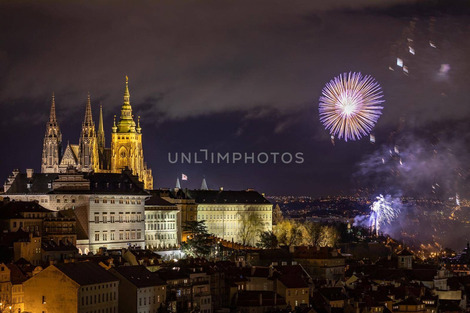 Fireworks over the Old Town of Prague, Czech Republic. New Year fireworks in Prague, Czechia. Prague fireworks during New Year Celebration near St. Vitus Cathedral, Prague, Czech republic.