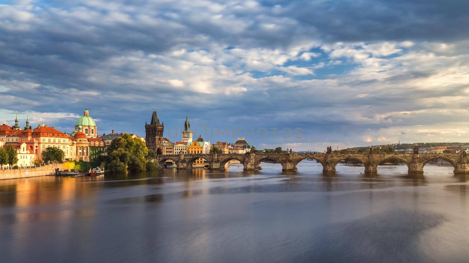 Prague Scenic spring sunset aerial view of the Old Town pier architecture and Charles Bridge over Vltava river in Prague, Czech Republic