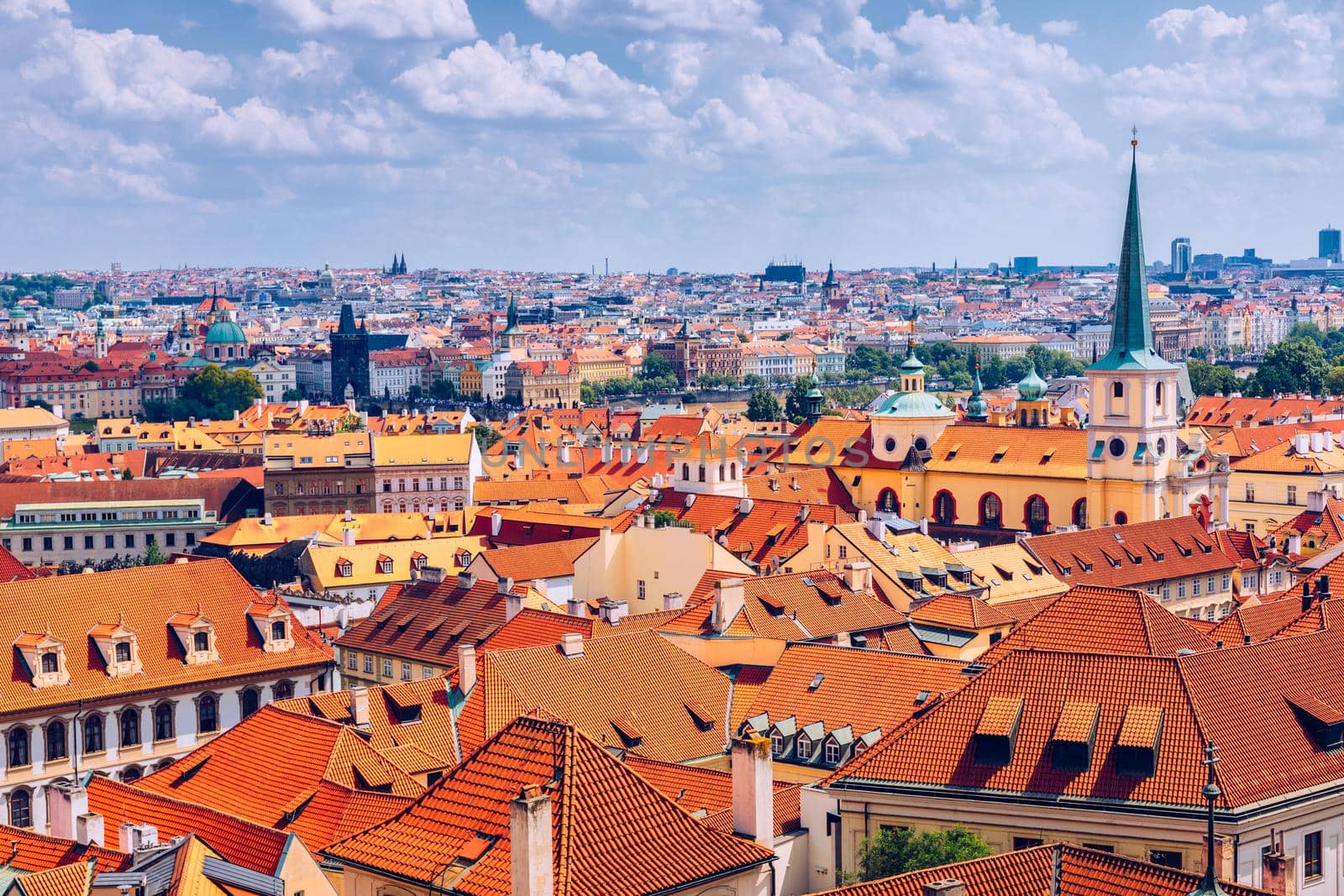 Top view to red roofs skyline of Prague city, Czech Republic. Aerial view of Prague city with terracotta roof tiles, Prague, Czechia. Old Town architecture with terracotta roofs in Prague.