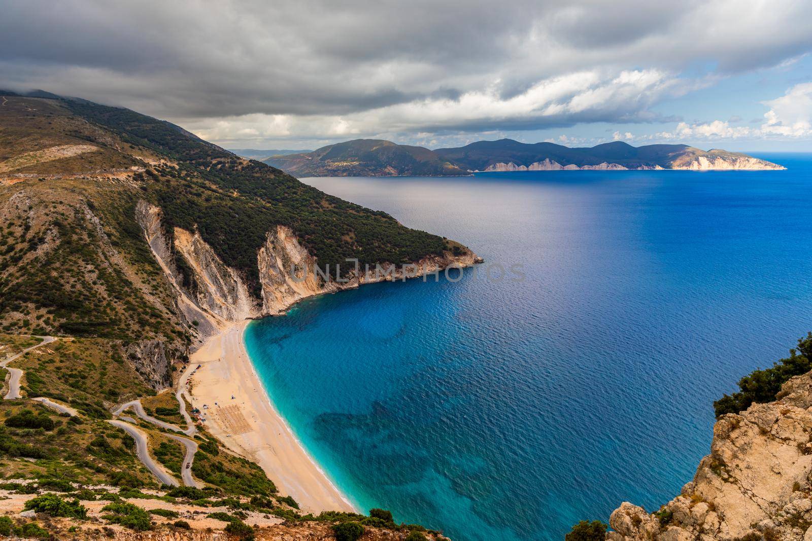 Aerial drone view of iconic turquoise and sapphire bay and beach of Myrtos, Kefalonia (Cephalonia) island, Ionian, Greece. Myrtos beach, Kefalonia island, Greece. Beautiful view of Myrtos beach.
