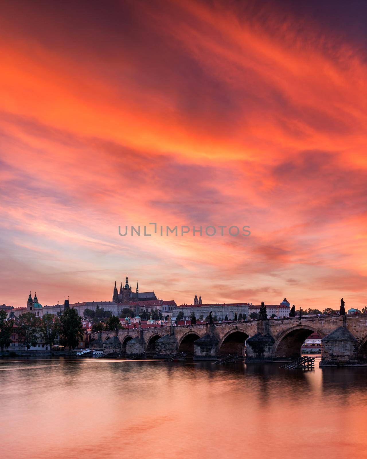 Charles Bridge at sunset with colorful sky, Prague, Czech Republic. Prague old town and iconic Charles bridge and Castle, Czech Republic. Charles Bridge (Karluv Most), Old Town Tower and Castle.