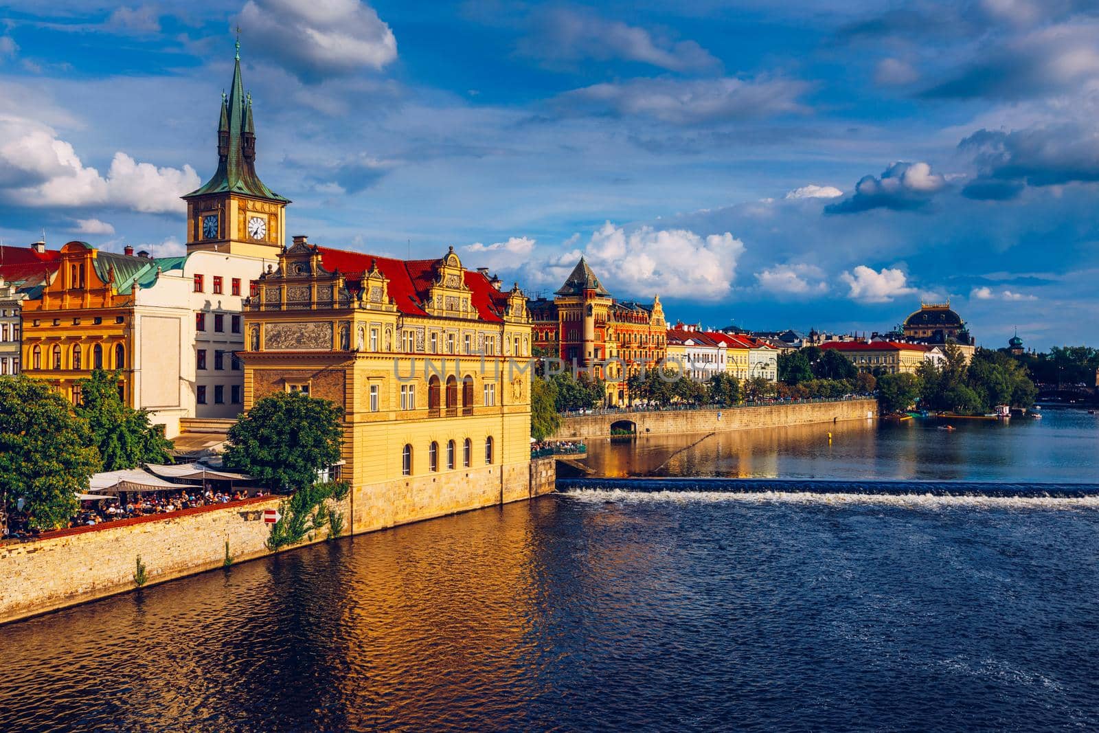 Prague in a sunny day, view of the old town, Prague, Czech Republic. Scenic summer view of the Old Town pier architecture and Charles Bridge over Vltava river in Prague, Czech Republic