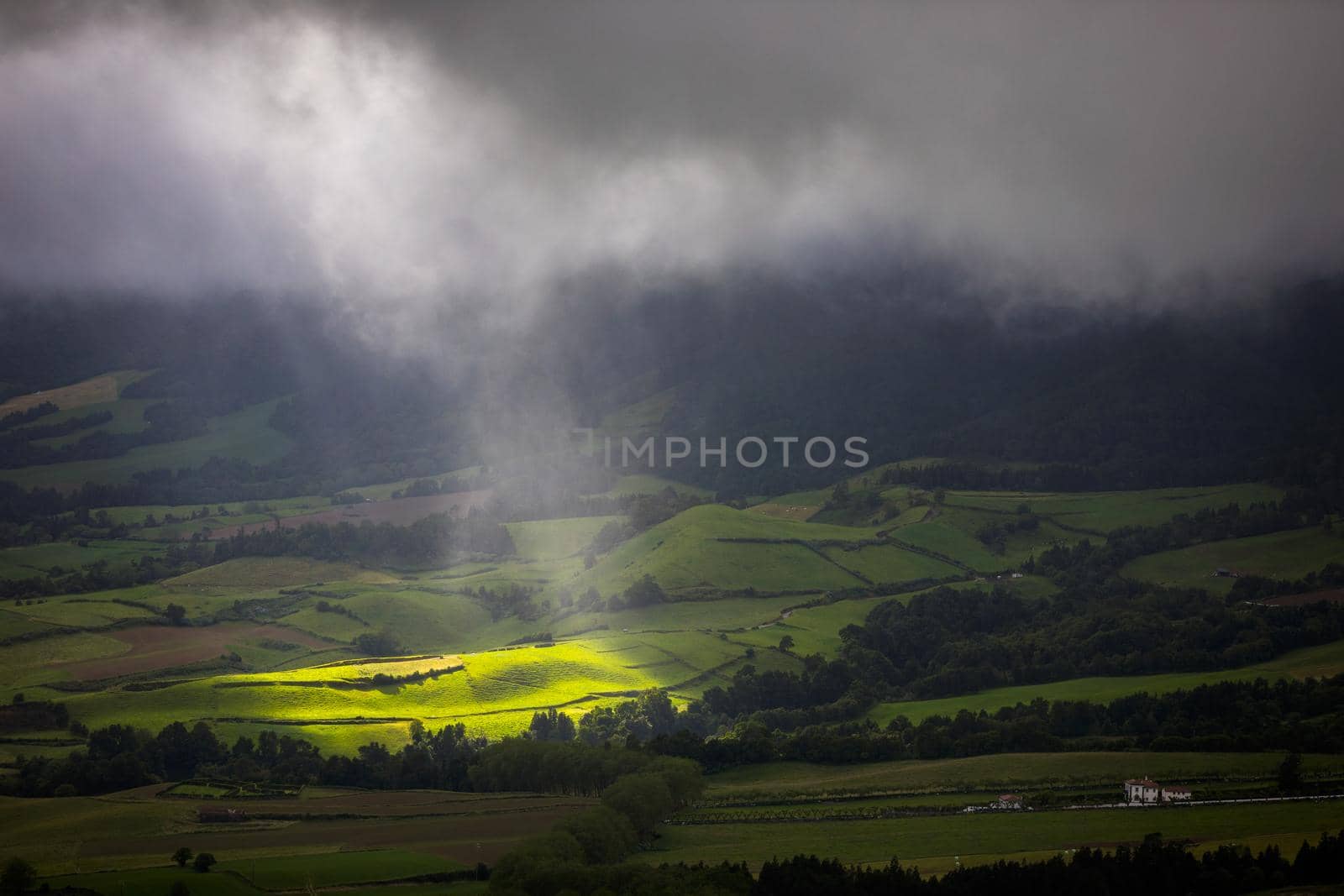 Azores panoramic view of natural landscape, wonderful scenic island of Portugal. Beautiful lagoons in volcanic craters and green fields. Tourist attraction and travel destination. Azores, Portugal.