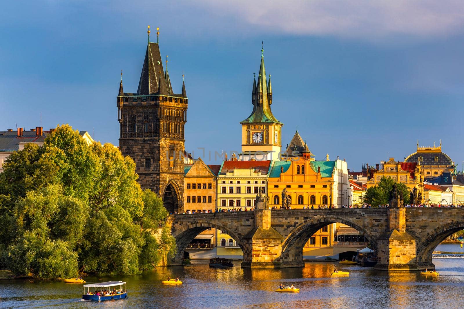Charles Bridge in Prague in Czechia. Prague, Czech Republic. Charles Bridge (Karluv Most) and Old Town Tower. Vltava River and Charles Bridge. Concept of world travel, sightseeing and tourism.