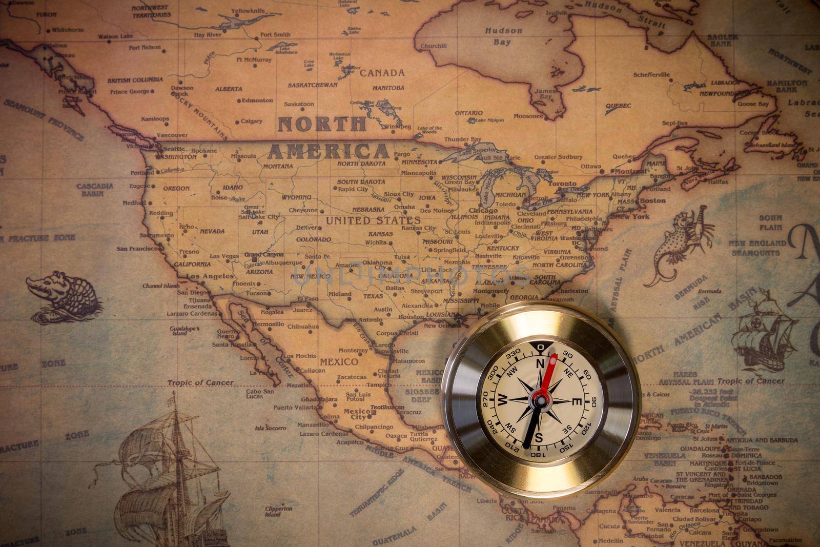 Columbus day and world map with compass