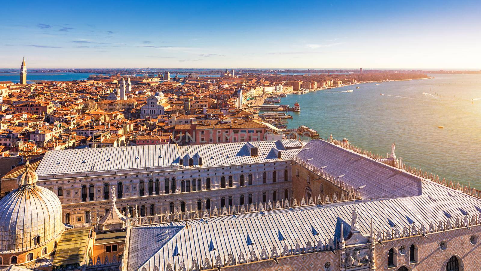 Venice panoramic aerial view with red roofs, Veneto, Italy. Aerial view with dense medieval red roofs of Venice, Italy 