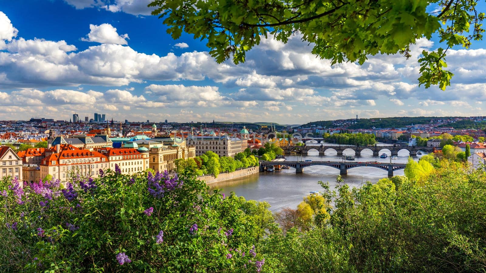 Scenic view of the Old Town pier architecture and Charles Bridge over Vltava river in Prague, Czech Republic. Prague iconic Charles Bridge (Karluv Most) and Old Town Bridge Tower at sunset, Czechia.