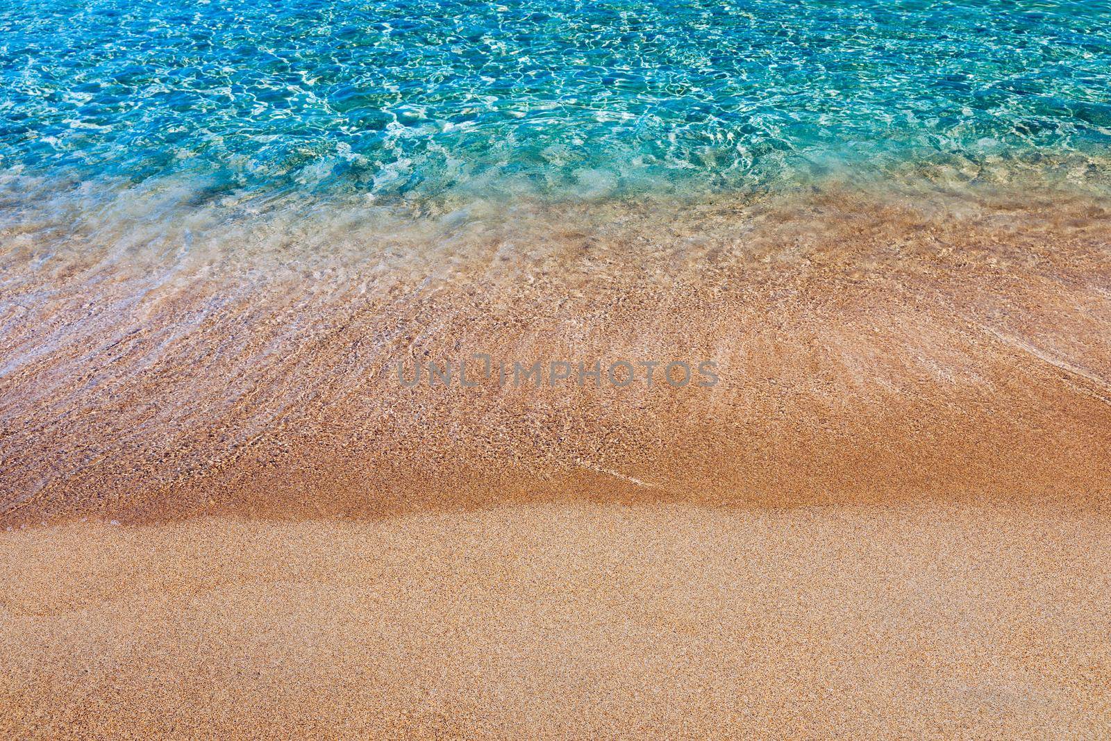 Yellow warm sand and summer sea with sky and free space. Sea, Sand, Sky and summer day. Beach and sea on a summer day, travel concept, vacation and relaxation. Summer sand beach and sea background.