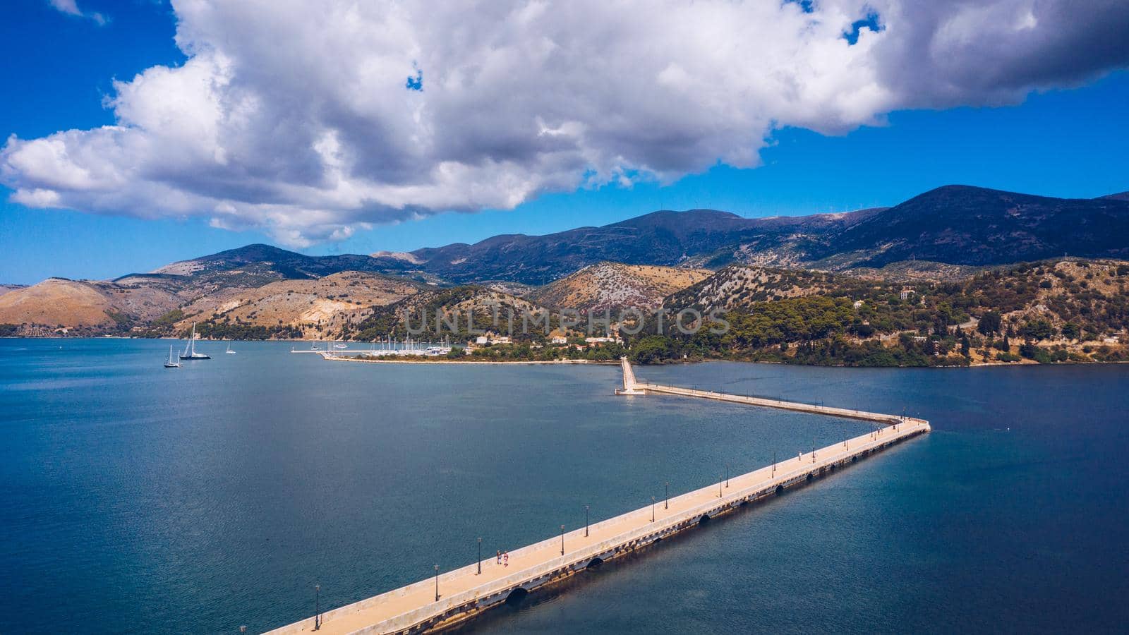 Aerial view of the De Bosset Bridge in Argostoli city on Kefalonia island. De Bosset Bridge on lakeside In Argostoli, Kefalonia. Obelisk and the de Bosset bridge in Argostoli, Kefalonia, Greece