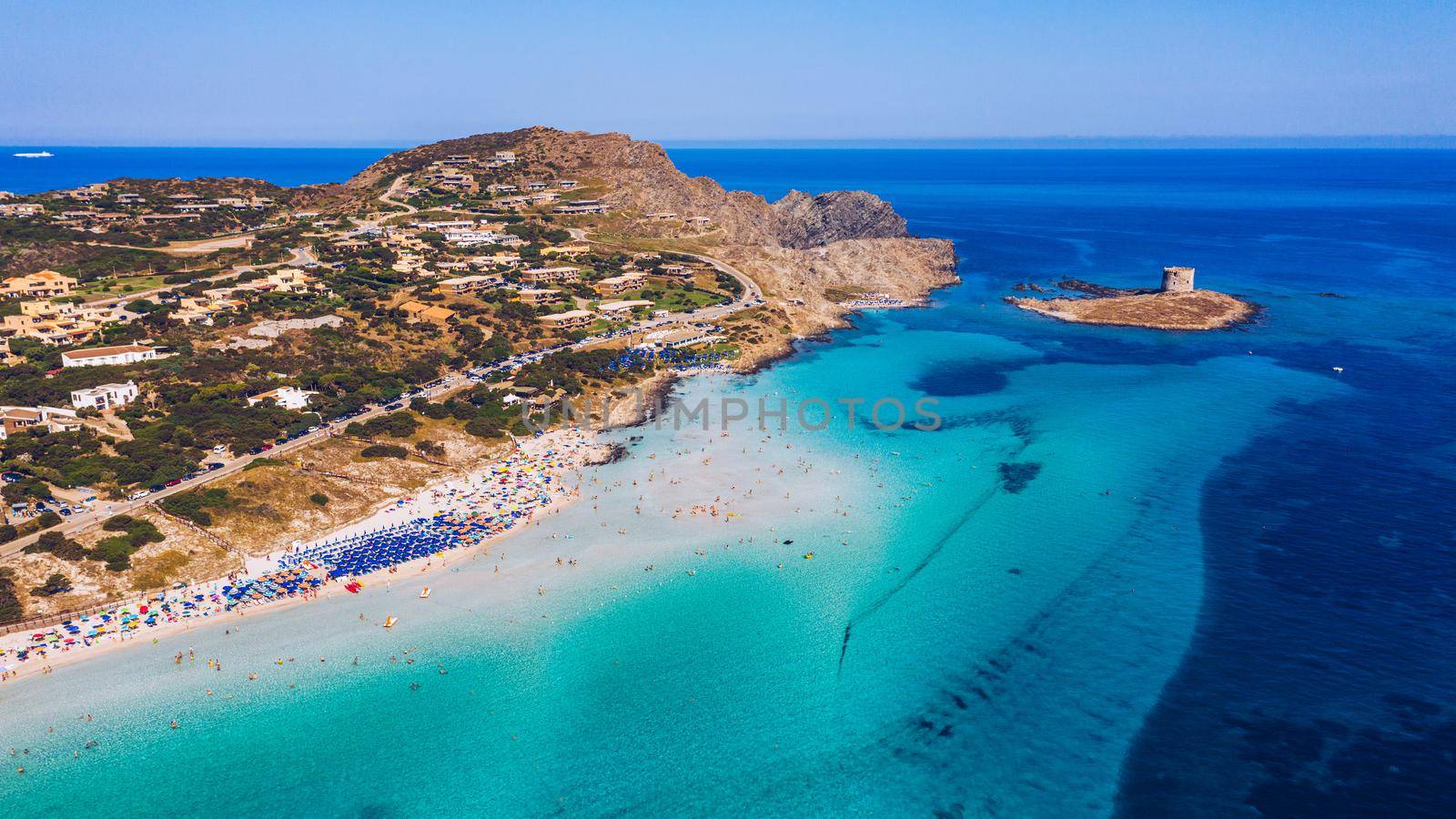 Stunning aerial view of Pelosa Beach (Spiaggia Della Pelosa) with Torre della Pelosa and Capo Falcone. Stintino, Sardinia, Italy. La Pelosa beach, probably the most beautiful beach in Sardinia, Italy