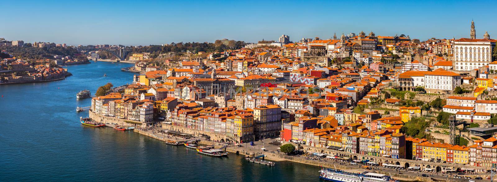 Panoramic view of Old city of Porto (Oporto) and Ribeira over Douro river, Portugal. Concept of world travel, sightseeing and tourism.