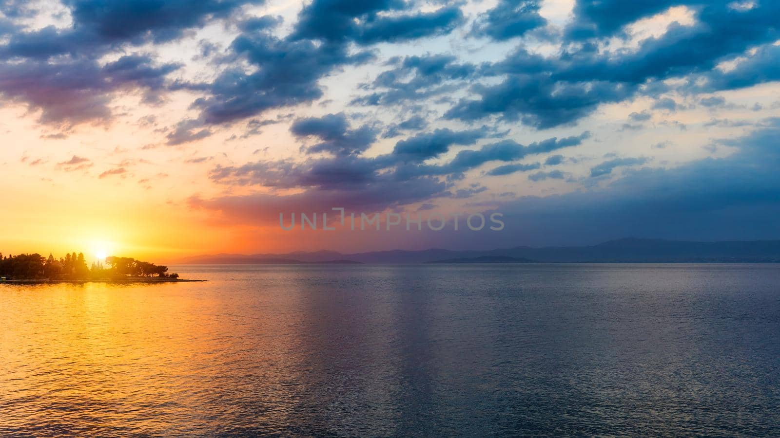 Sunset or sunrise sky above the sea. Nature, weather, atmosphere, travel theme. Sunrise or sunset over the sea. Panorama