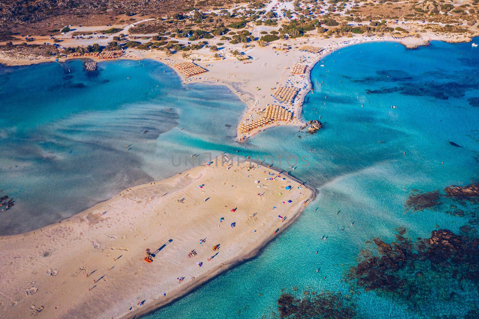 Aerial drone shot of beautiful turquoise beach with pink sand Elafonissi, Crete, Greece. Best beaches of Mediterranean, Elafonissi beach, Crete, Greece. Famous Elafonisi beach on Greece island, Crete.